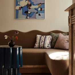 Living Room Corner Sofa with Wavy Back and vintage Art