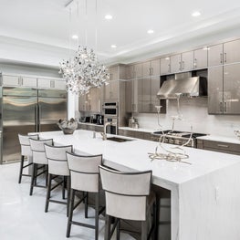 SLEEK CONTEMPORARY METALLIC RESIDENCE metalic kitchen cabinets, open concept kitchen, large kitchen island, eat in kitchen, sub zero rerfigerators