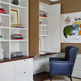 A custom desk to hide the mess. 