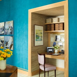 Kips Bay Showhouse office nook with built-in shelving and textured teal walls