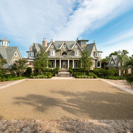 Front Elevation of an Oceanfront Shingle Style Home with Pea Gravel Drive Court