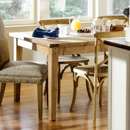 Patterned upholstered dining chairs w farm table by Sophia Shibles Interiors