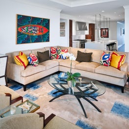 Pops of bright colors enhance the neutral colored furniture and walls.