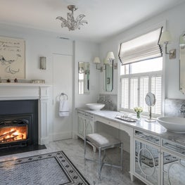 Glamorous Master Bathroom with Double Vanity and Fireplace