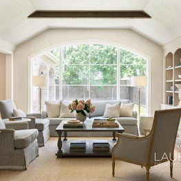 Our team installed a mammoth arch to allow more light into this lovely living room.