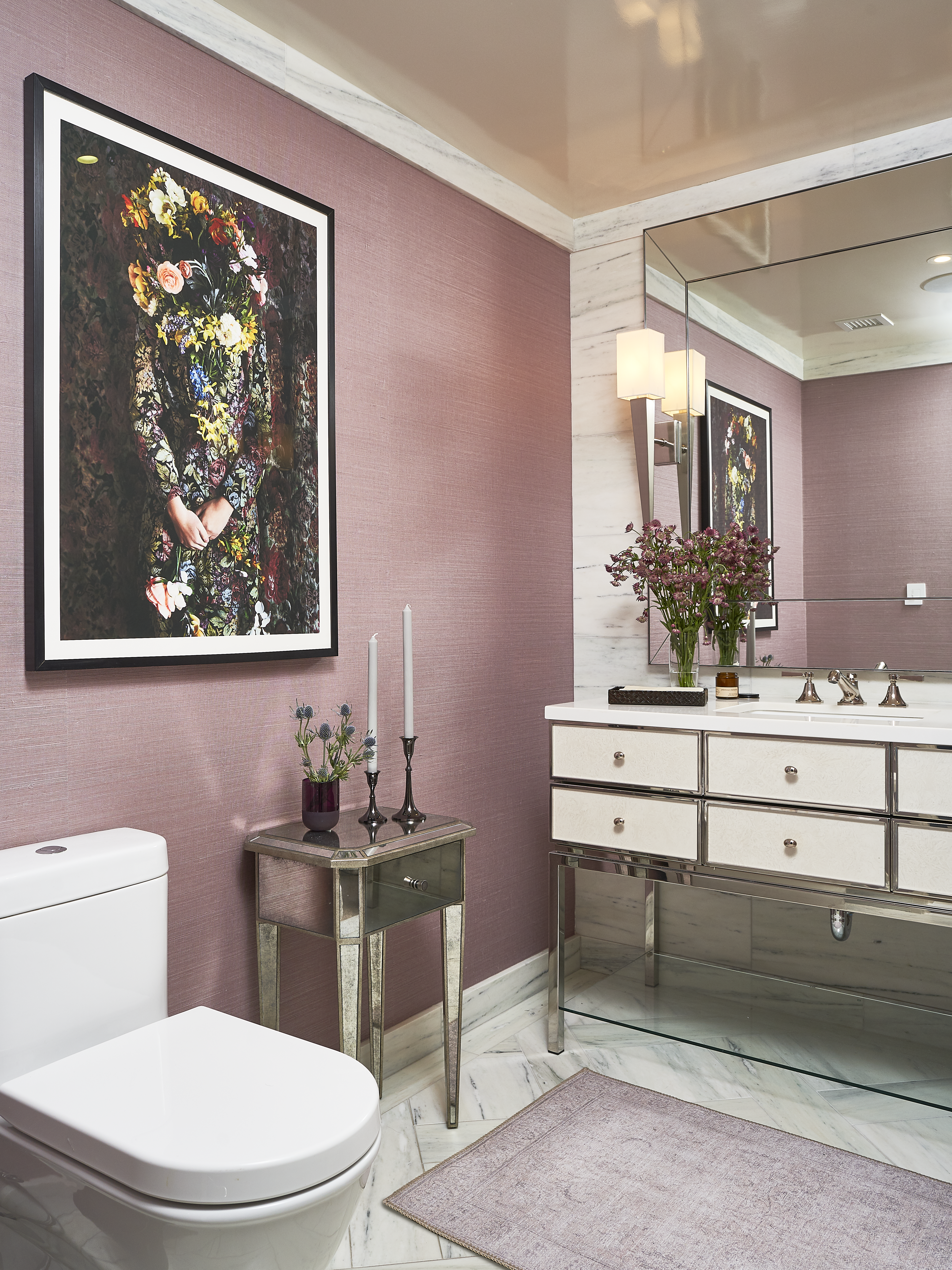 Luxurious Tribeca powder room in subtle pink and mirrored accents