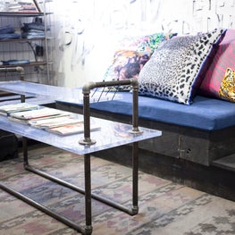 Custom Wallpaper Wall Application for a Denim Washhouse Showroom with Custom Silk & Leather Throw Pillows