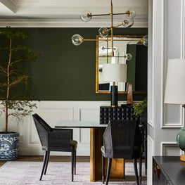 Dining Room View with Earthy Green Walls and Nude Geometric Rug