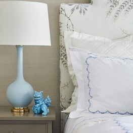 Vintage foo dog ceramic and hints of blue in this guest bedroom vignette