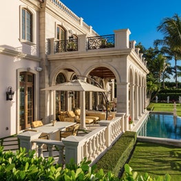 A classical lakefront arcade on a waterfront Palm Beach estate