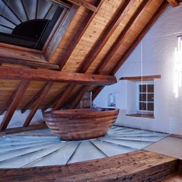 Swiss Chalet Master Bath with Freestanding Tub and Glass Shower Enclosure