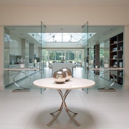 Single storey contemporary striking home with glass fronted entrance hall 