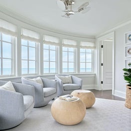 Sitting Area, Bensen club chairs from Hide, custom hollow pouf ottomans by Andrea Goldman Design