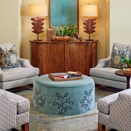 Soft colored velvet combined with intricate pattern and warm wood tones.