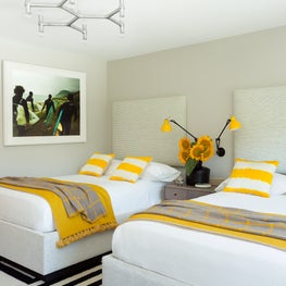 East Hampton Residence - guest bedroom with yellow bedding details