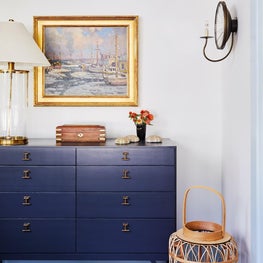 Blue and white dining room with mid century furniture