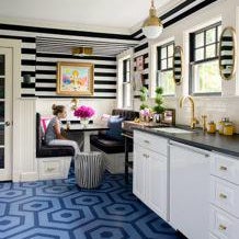 Kitchen and Breakfast Nook with Painted Floors and Striped Wallpaper