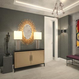 Layers of texture accented by a gilded gold oval mirror makes this room pop.