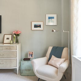 Clean and classic sitting area in bedroom, beige and soft greens