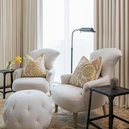 Portfolio: Houston High-rise, Living Room with a neutral palette and statement end tables