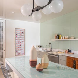 Portfolio: Indo-Asian inspired Houston high-rise kitchen with bold pendant light fixture