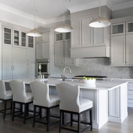 Custom Kitchen with custom seating for quartz top island 