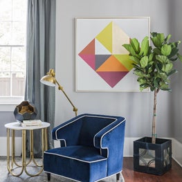 Detail of sitting nook in family room showing abstract art and custom upholstery