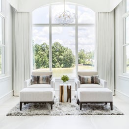 Portfolio: Master suite with relaxing outdoor view and stunning light fixture