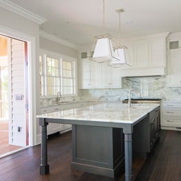 Kitchen with Large Island and Folding Doors opening to Screened Porch