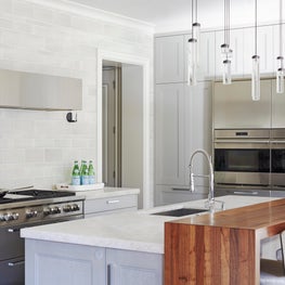 Contemporary Kitchen with wooden waterfall breakfast counter