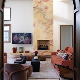 Warm and Cozy Family Room with Soaring Onyx Fireplace