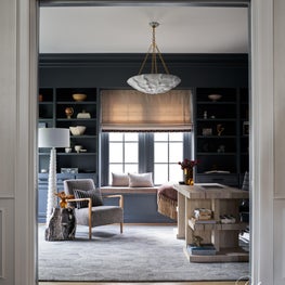 Drawing inspiration from our client's love of the ocean, we integrated shades of blue and natural materials into this home study.