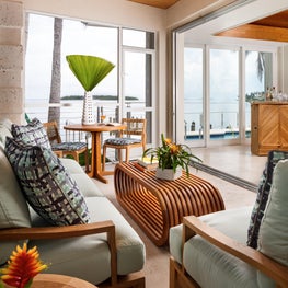 A Bohemian blend of organic materials and color complement this tropical setting