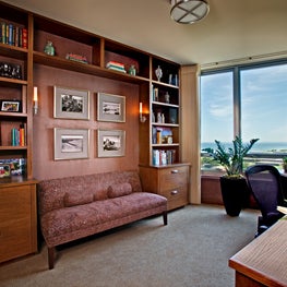 Lake Shore Drive Home Office. Lakefront Study with built ins, upholstered walls and period photos of Navy Pier.