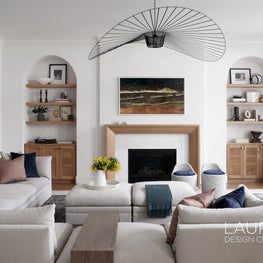 Subtle architectural arches and warm wood inclusions set the tone for a casual yet sophisticated family room.