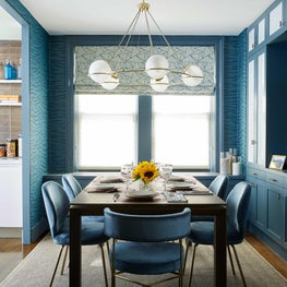 Modern dining room with teal accents