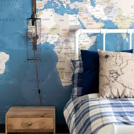 Portfolio: Stunning boys bedroom with a nautical lamp and a playful map wallcovering