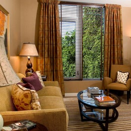 Electicism that works: balance of styles- color; a warm inviting small space