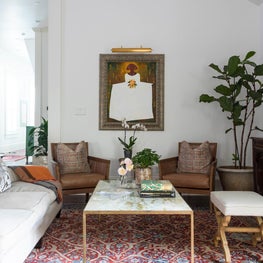 Living Room with original art and layered seating 