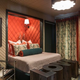 Bed created inside a former closet with textured walls