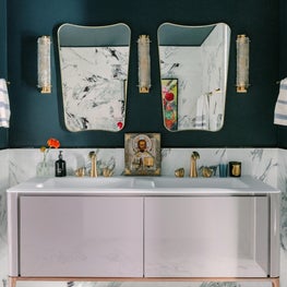 Master Bathroom with lacquer vanity, mid century mirrors and brass fixtures 