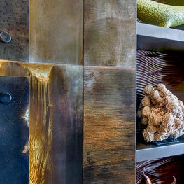 Heavily antiqued, the rust brown tones and burnished distressing creates the fireplace a captivating look