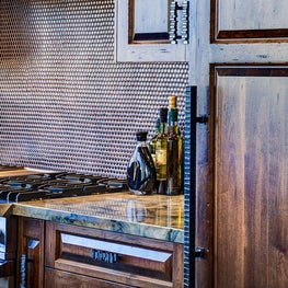 The detailing and finish of the custom Alder cabinets is classic yet distinctive. 