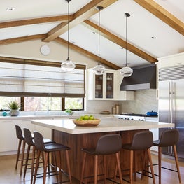 Large Kitchen island is ideal for the family to gather, cook and work