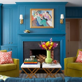 Living Room with Art and Sconces over Fireplace
