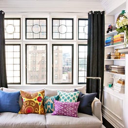 Black and White Pied a Terre with colorful pillows 