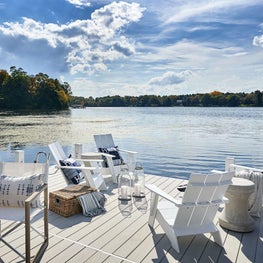 Dock, Outdoor Living, Hermes Pillows, Design Within Reach Adirondack Chairs, Made Goods Table, Raoul Textiles Pillow — Pine Lake Project