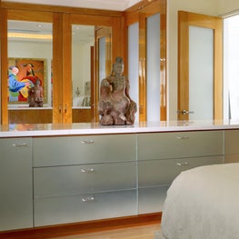 Palm Beach bedroom with sandblasted mirror cabinets