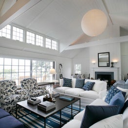 A renovated Living room with new painted planking and clerestory windows
