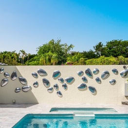 LAKEFRONT CONTEMPORARY VILLA inground pool, outdoor sculpture, metalic sculpture